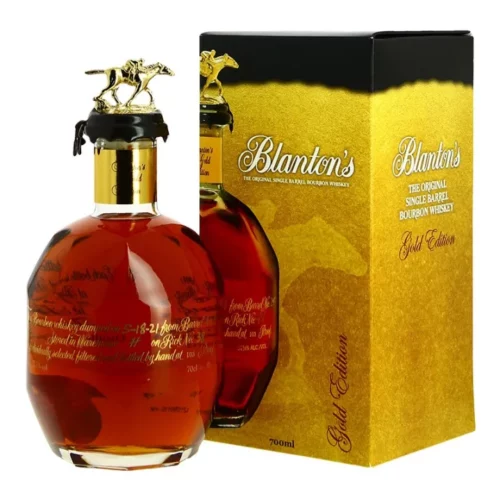 Bourbon Blanton’s Gold Edition 70 cl, bouteille ronde avec bouchon noir et cheval galopant doré, boîte cadeau dorée.