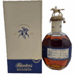 Bouteille de bourbon Blanton’s Single Barrel numéro 665, avec bouchon métallique équestre, accompagnée d’un emballage-carton “Limited Edition 2015-1995”, couleur ambrée.
